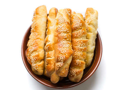 Homemade sesame pastry in a bowl on white