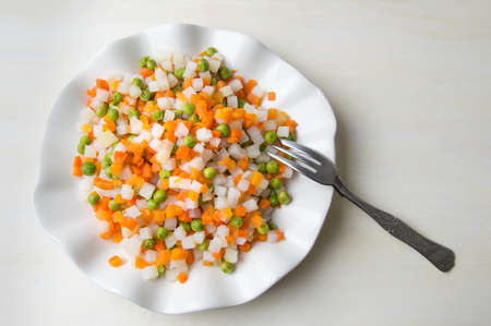 Cooked vegetables on a plate for making saladの写真素材