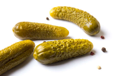 Four of pickled cucumbers on white backgroundの写真素材