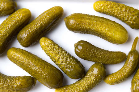 Bunch of pickled cucumbers on white backgroundの写真素材