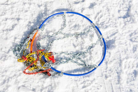 Snow chains on the road ready to be mounted
