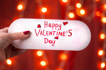 Happy Valentines day card against red festive backgroundの写真素材