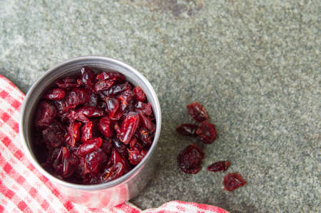 Dry cranberry fruits in a metal canの写真素材