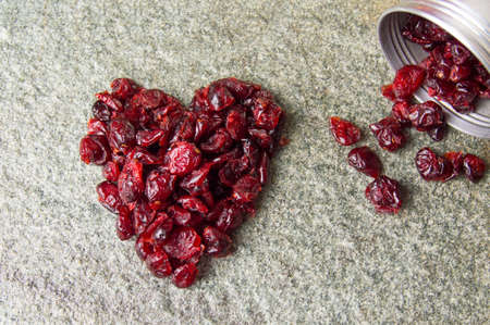 Heart shape made from dry cranberry fruitsの写真素材