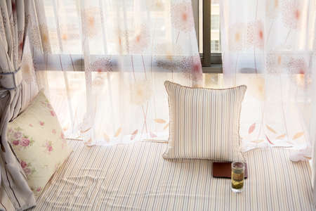 Bay window interior with matching mattress and curtain