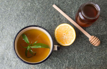 Cannabis herbal tea with lemon on stone tableの写真素材