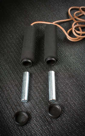 Jump rope with weights taken out on yoga matの写真素材