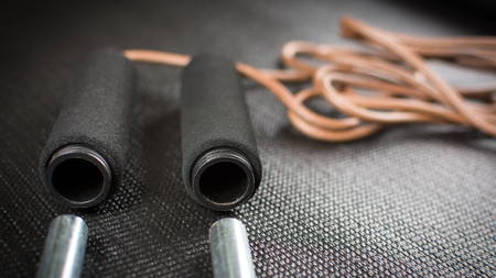 Jump rope with weights taken out on yoga matの写真素材