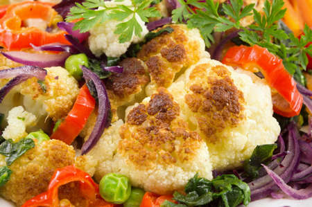 fried cauliflower and mixed vegetables close upの写真素材
