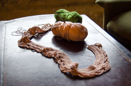 Crocheting accessories on a vintage table
