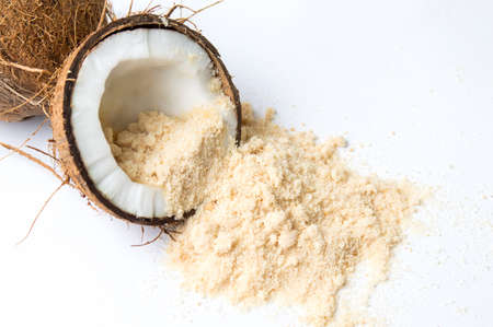 Coconut fruit and sugar on white backgroundの写真素材