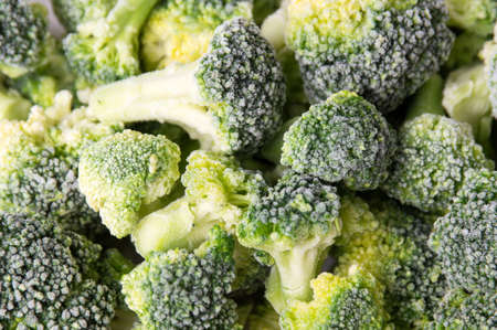 Frozen broccoli on a pile making background