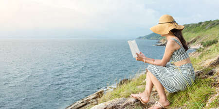 Woman reading a book with the perfect horizon view