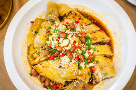 Chinese chicken salad with various ingredients on a plateの写真素材