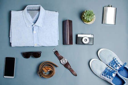 Male clothes and fashion accessories on blue background flatlayの写真素材