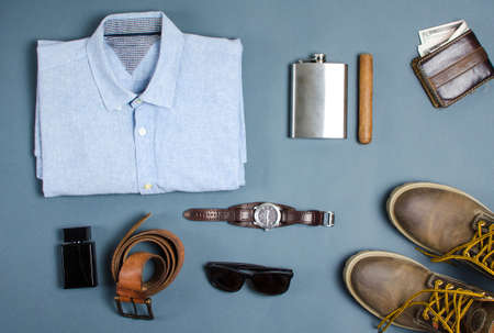 Male clothes and fashion accessories on blue background flatlayの写真素材