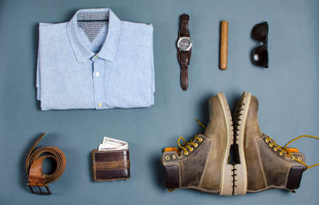 Male clothes and fashion accessories on blue background flatlayの写真素材