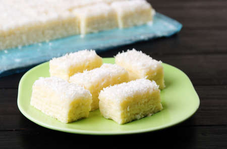 Homemade coconut candy on a green plate
