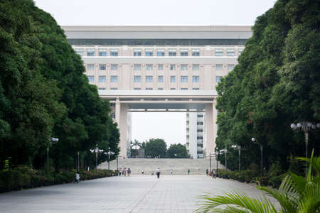 NANNING, CHINA - SEPTEMBER 20, 2016: Guangxi university building entrance with students walking on a sunny dayのeditorial素材
