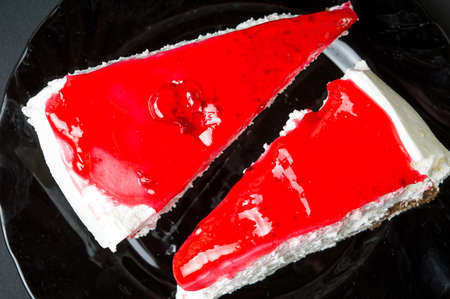 Two strawberry cheesecake slices on a plate