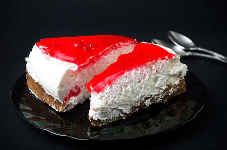 Two strawberry cheesecake slices on a plateの写真素材