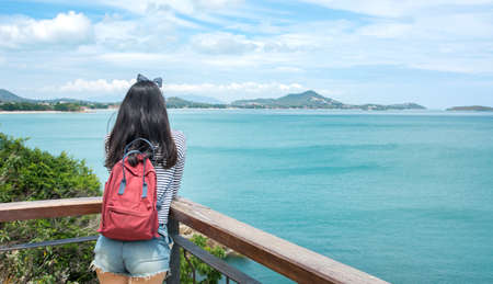 Girl enjoying on a seaside viewpoint in Samui island Thailandの写真素材