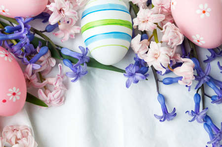 Painted Easter eggs and hyacinth flowers in bloomの写真素材