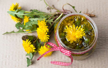 Dandelion flowers with homemade oil top viewの写真素材