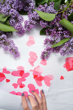 Female opening letter full of red heartsの写真素材