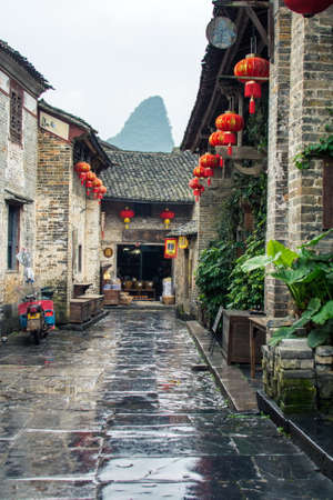 HUZHOU, CHINA - MAY 3, 2017: Huang Yao Ancient Town in Zhaoping county, Guangxi province. Traditional Chinese architecture and street decorationのeditorial素材