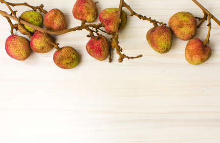 Lychee tropical fruit on a wooden table