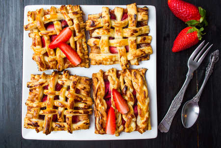 Sweet strawberry pie with fresh fruit on a plateの写真素材