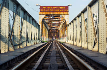 HANOI, VIETNAM - MAY 24, 2017: Hanoi Long Bien bridge with train rail which connects two parts of the city across the Red riverのeditorial素材