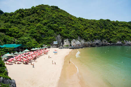CAT BA, VIETNAM - MAY 26, 2017: Cat ba island city beach Cat co 1 with tourist sunbathing on the sand and calm seaside. Cat co beach number 1 is the biggest beach on the islandのeditorial素材