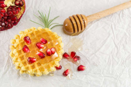 Waffle cookies with honey and pomegranate fruit