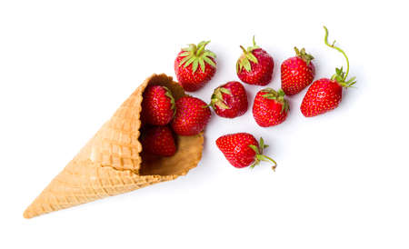 Strawberries in an ice cream cone on whiteの写真素材