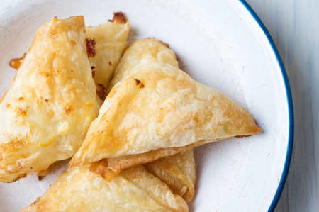 Homemade triangle salty pie on a plateの写真素材