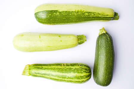 Zucchini, green summer squash on white backgroundの写真素材
