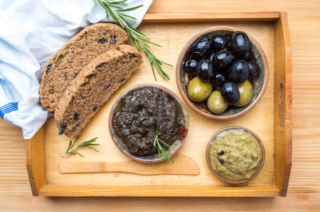 Healthy breakfast with olive bread, spread and fruitの写真素材