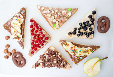 Sweet triangle sandwiches with fruit and creamの写真素材