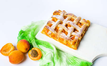 Sweet fruit pie slice with apricot on a plateの写真素材