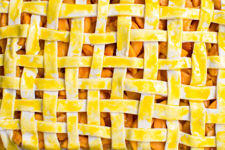 Unbaked homemade fruit sweet pie golden crust patternの写真素材