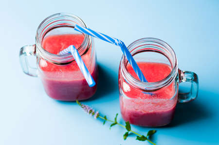 Two jars of healthy watermelon smoothie. Summer refreshmentの写真素材