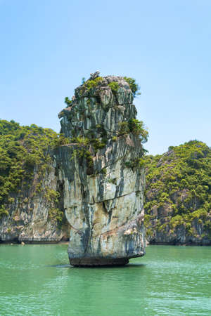 Limestone rocks and calm sea of Halong bay in Vietnamの写真素材