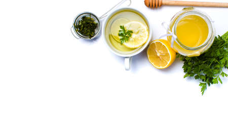 Parsley tea with lemon and honey on whiteの写真素材