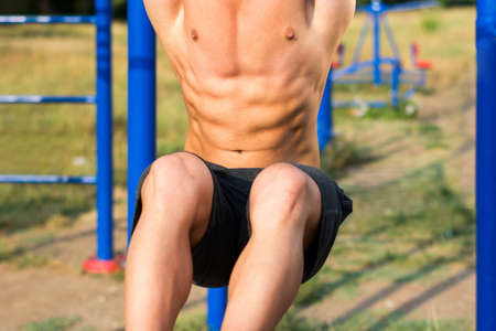 Man performing crunches during a street workout