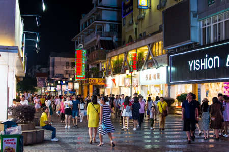 GUILIN, CHINA - JUNE 11, 2017: People in the Zhengyang, famous walking street, visited by many local and foreign tourists. Primarily meant for recreation and shopping, Zhengyang Walking Street is the hub of tourists, and see a lot of activity throughout dのeditorial素材