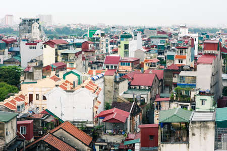 HANOI, VIETNAM - MAY 24, 2017: Panoramic aerial view at Hanoi old city houses and buildings during the day. Ancient architecture and traditional homes with modern building in the backgroundのeditorial素材