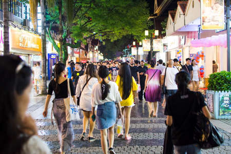 GUILIN, CHINA - JUNE 11, 2017: People in the Zhengyang, famous walking street, visited by many local and foreign tourists. Primarily meant for recreation and shopping, Zhengyang Walking Street is the hub of tourists, and see a lot of activity throughout dのeditorial素材