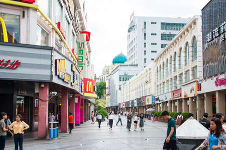 GUILIN, CHINA - JUNE 9, 2017: People in the Zhengyang, famous walking street for recreation and shopping, Zhengyang Walking Street is the hub of tourists, and see a lot of activity throughout day till late at nightのeditorial素材